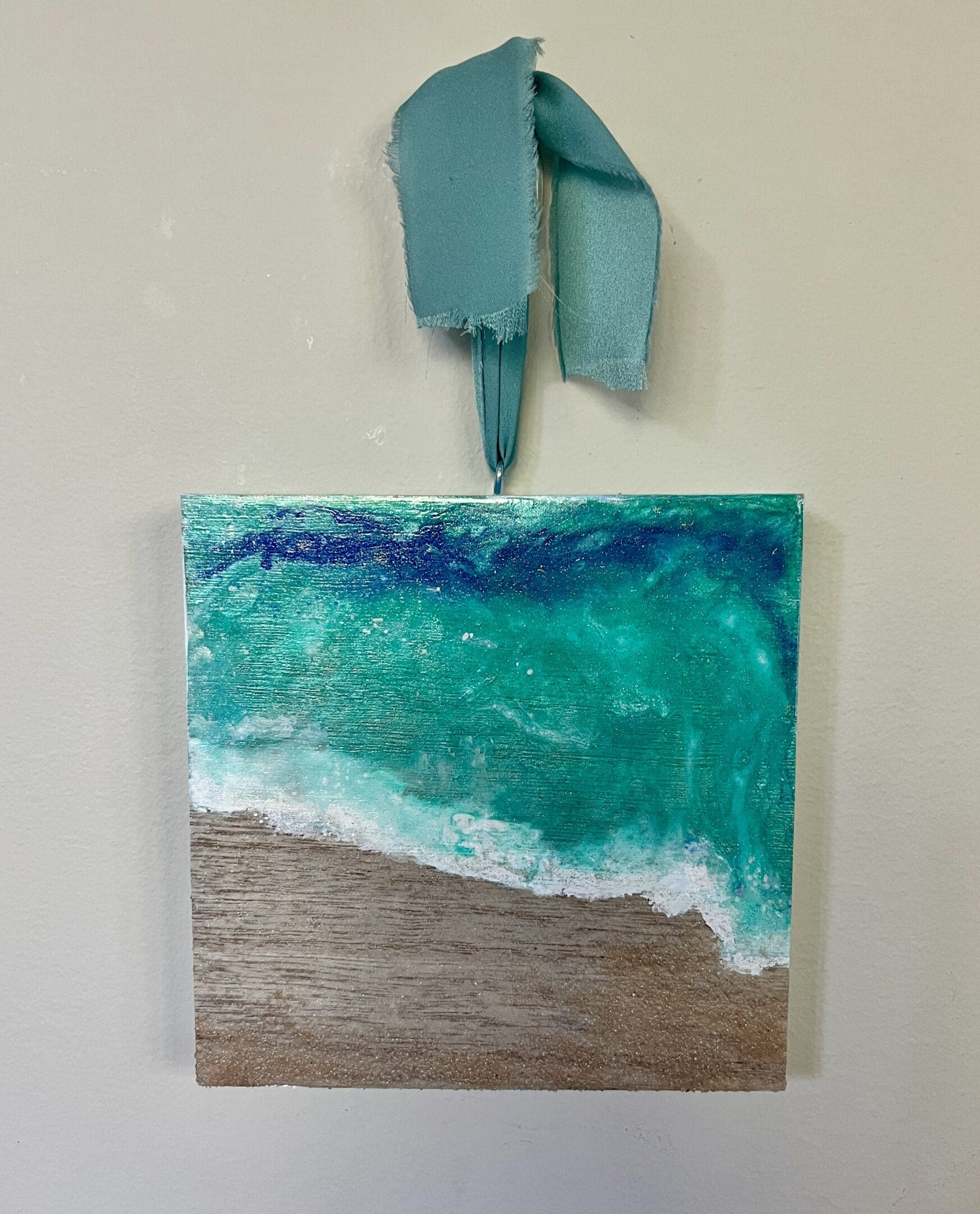 A painting of the ocean on a wall